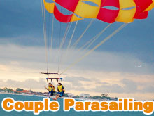 Couple parasailing